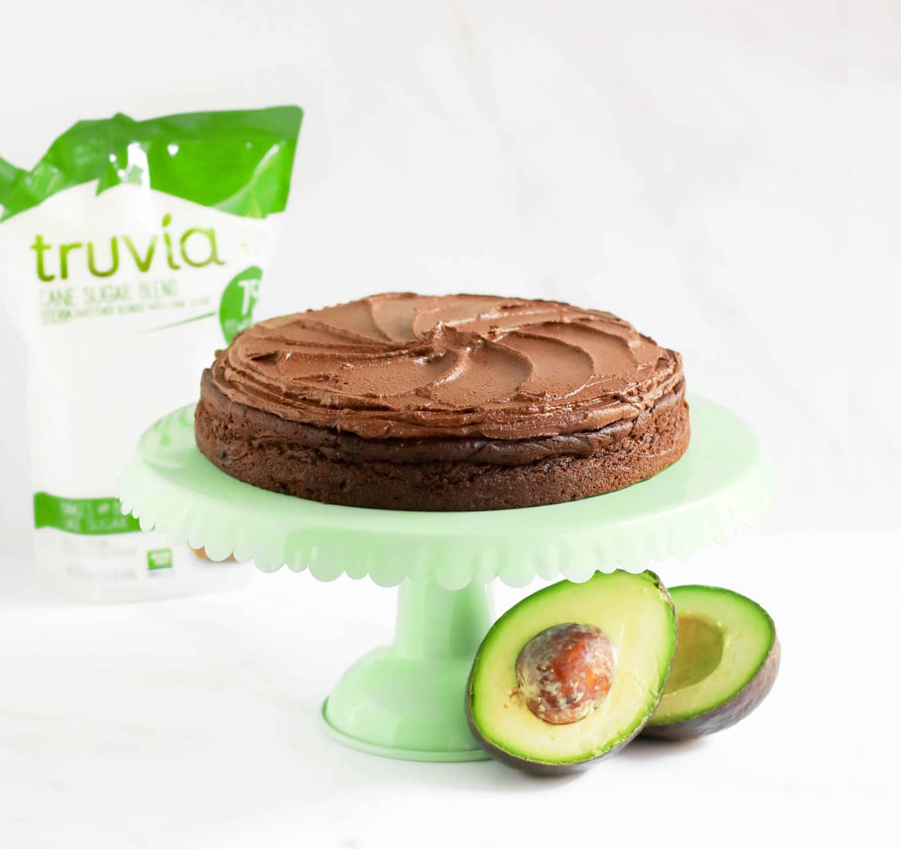 This healthier Chocolate Avocado Cake is super chocolatey, perfectly sweet, and nutritionally balanced with healthy fats, whole grains, lots of fiber, and a hit of protein! It's just as rich, and chocolatey as classic chocolate cake, except this is made without the butter, oil, regular white sugar, and bleached flour!