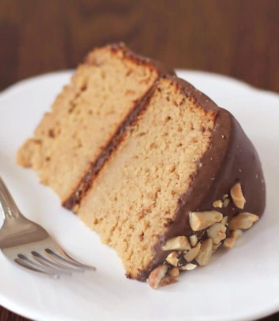 This Healthy Peanut Butter Cake is topped with a Guilt-Free Chocolate Frosting. It's so sweet and delicious you'd never know it's low sugar, high protein, high fiber, and gluten free!