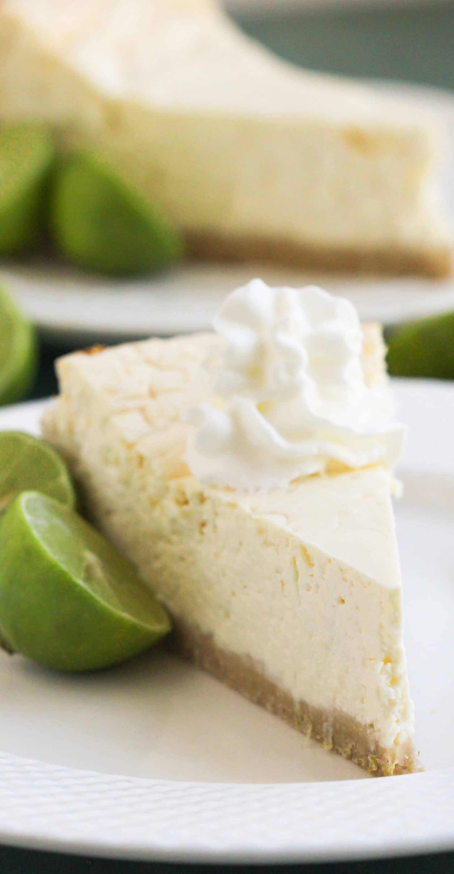 This Healthy Key Lime Cheesecake tastes like Key Lime Pie but in CHEESECAKE form! Each bite is sweet, refreshing, and delicious, you'd never suspect it's sugar free, gluten free, and high protein. -- Healthy Dessert Recipes with sugar free, low calorie, low fat, high protein, gluten free, dairy free and vegan options at the Desserts With Benefits Blog (www.DessertsWithBenefits.com)