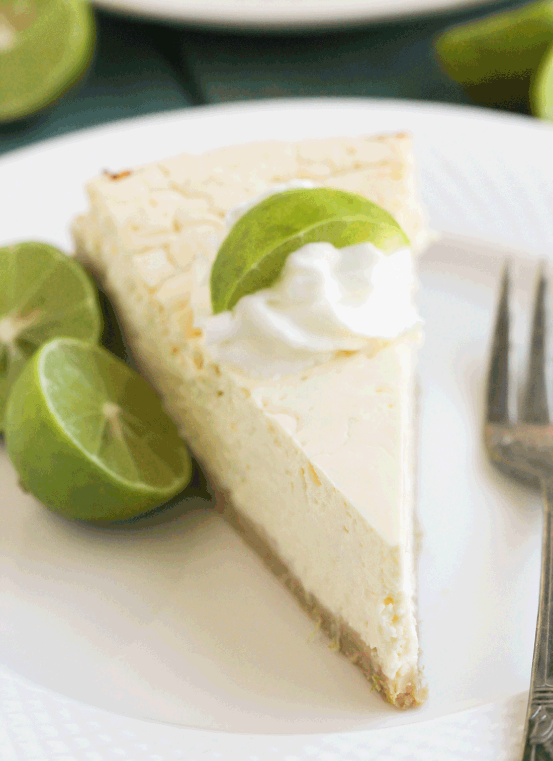 This Healthy Key Lime Cheesecake tastes like Key Lime Pie but in CHEESECAKE form! Each bite is sweet, refreshing, and delicious, you'd never suspect it's sugar free, gluten free, and high protein. -- Healthy Dessert Recipes with sugar free, low calorie, low fat, high protein, gluten free, dairy free and vegan options at the Desserts With Benefits Blog (www.DessertsWithBenefits.com)