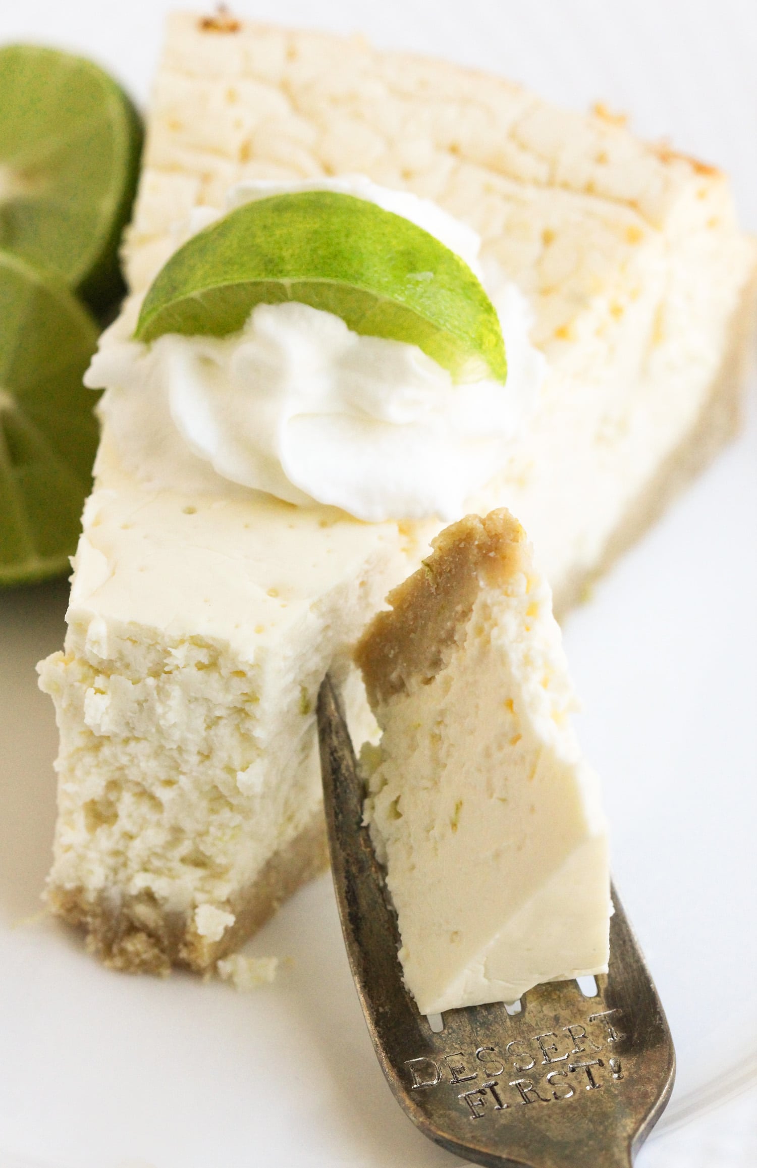 This Healthy Key Lime Cheesecake tastes like Key Lime Pie but in CHEESECAKE form! Each bite is sweet, refreshing, and delicious, you'd never suspect it's sugar free, gluten free, and high protein. -- Healthy Dessert Recipes with sugar free, low calorie, low fat, high protein, gluten free, dairy free and vegan options at the Desserts With Benefits Blog (www.DessertsWithBenefits.com)