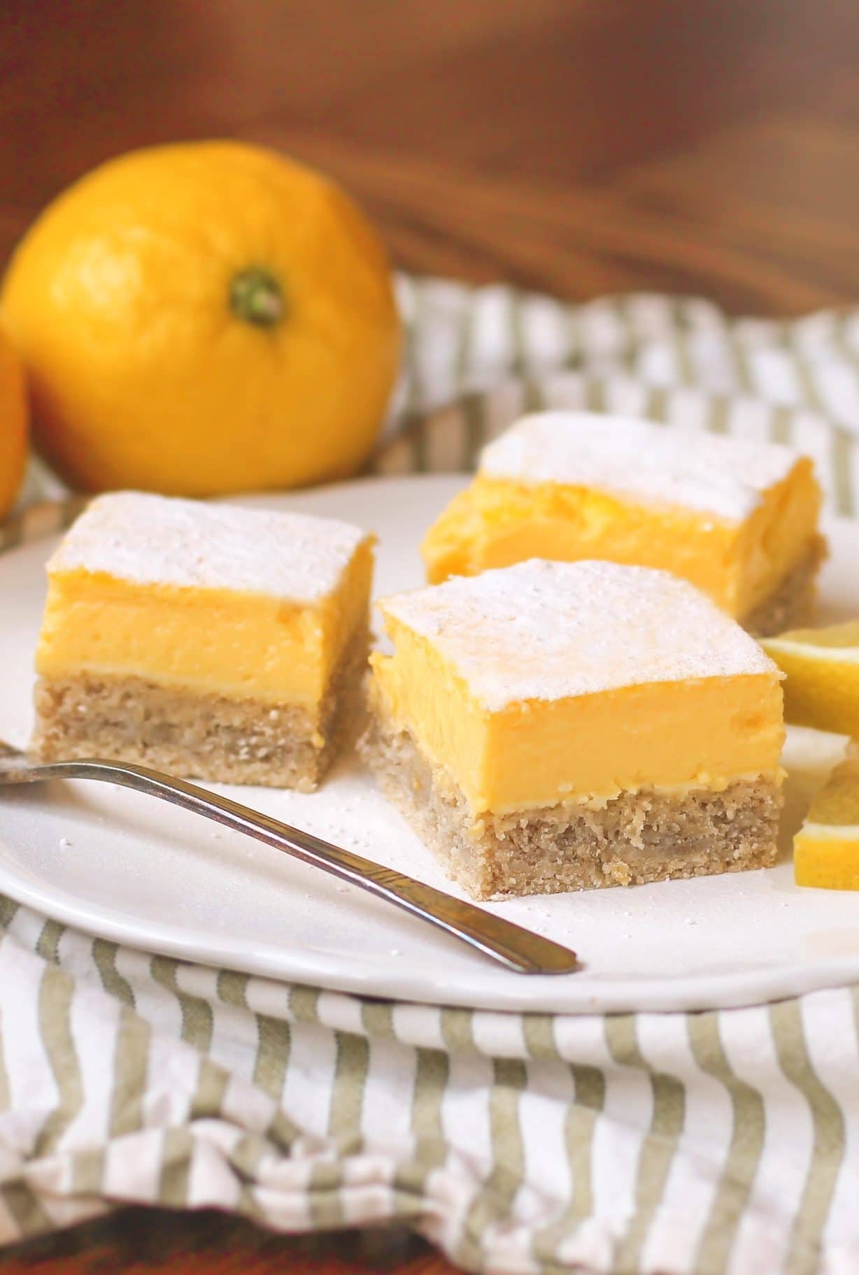 These delicious Lemon Bars are made without any sugar, butter, and flour, but they're just as tart and sweet as the original! You'd never know they're sugar free, gluten free, dairy free, and high protein too!