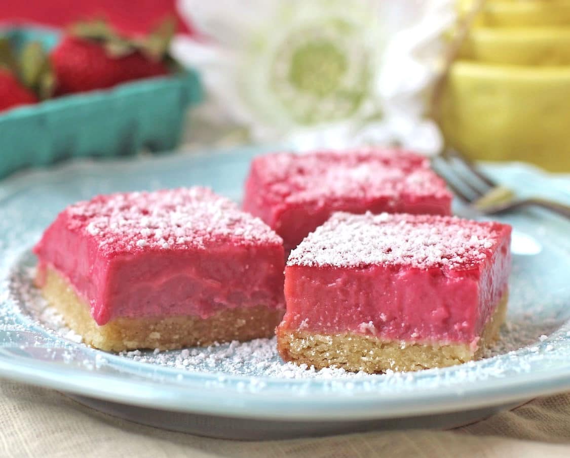 These Raspberry Lemon Bars are sweet, simple and satisfying. They taste like they're full of sugar and butter, but shhhh, they're healthy! You'd never guess these Pink Raspberry Lemonade Bars are sugar free, gluten free, dairy free, paleo, keto, and even high protein too!