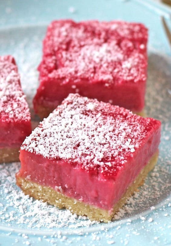 These Raspberry Lemon Bars are sweet, simple and satisfying. They taste like they're full of sugar and butter, but shhhh, they're healthy! You'd never guess these Pink Raspberry Lemonade Bars are sugar free, gluten free, dairy free, paleo, keto, and even high protein too!