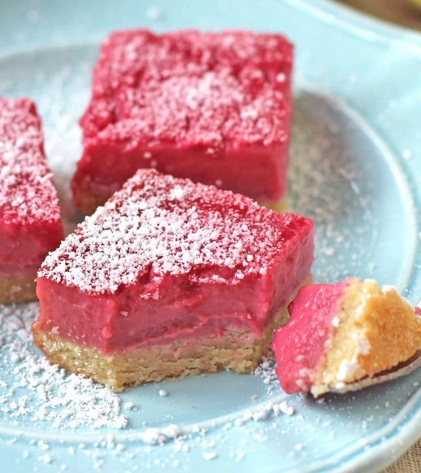 These Raspberry Lemon Bars are sweet, simple and satisfying. They taste like they're full of sugar and butter, but shhhh, they're healthy! You'd never guess these Pink Raspberry Lemonade Bars are sugar free, gluten free, dairy free, paleo, keto, and even high protein too!