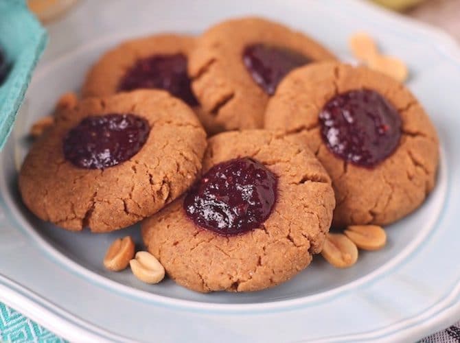 These Healthy Peanut Butter and Jelly Thumbprint Cookies are soft, chewy and delicious. You'd never they're sugar free, high protein, gluten free and vegan! -- Healthy Dessert Recipes at Desserts with Benefits