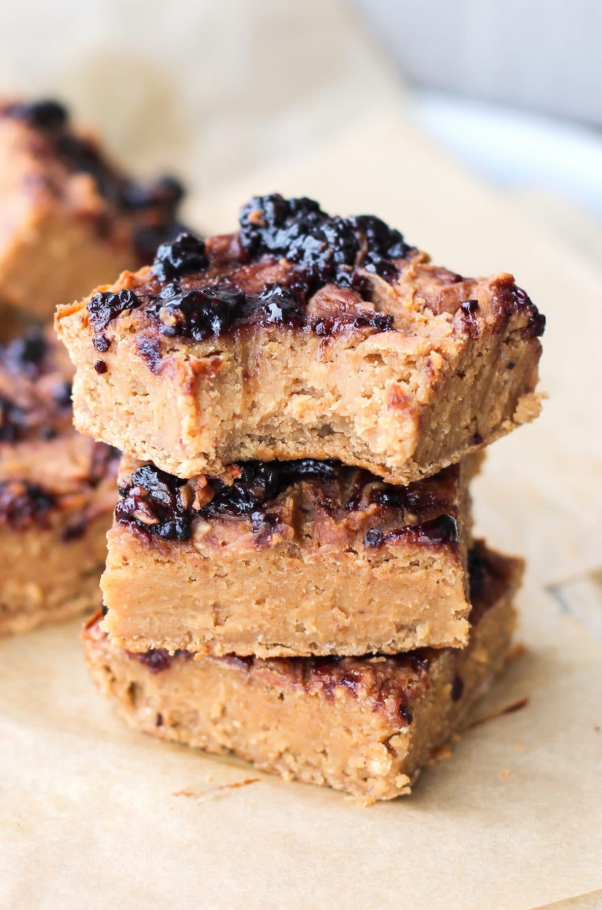 These Healthy Peanut Butter and Jelly Blondies are SUPER dense, fudgy, and rich. Also guilt-free, refined sugar free, high protein, gluten free and vegan! - Healthy Dessert Recipes at Desserts with Benefits