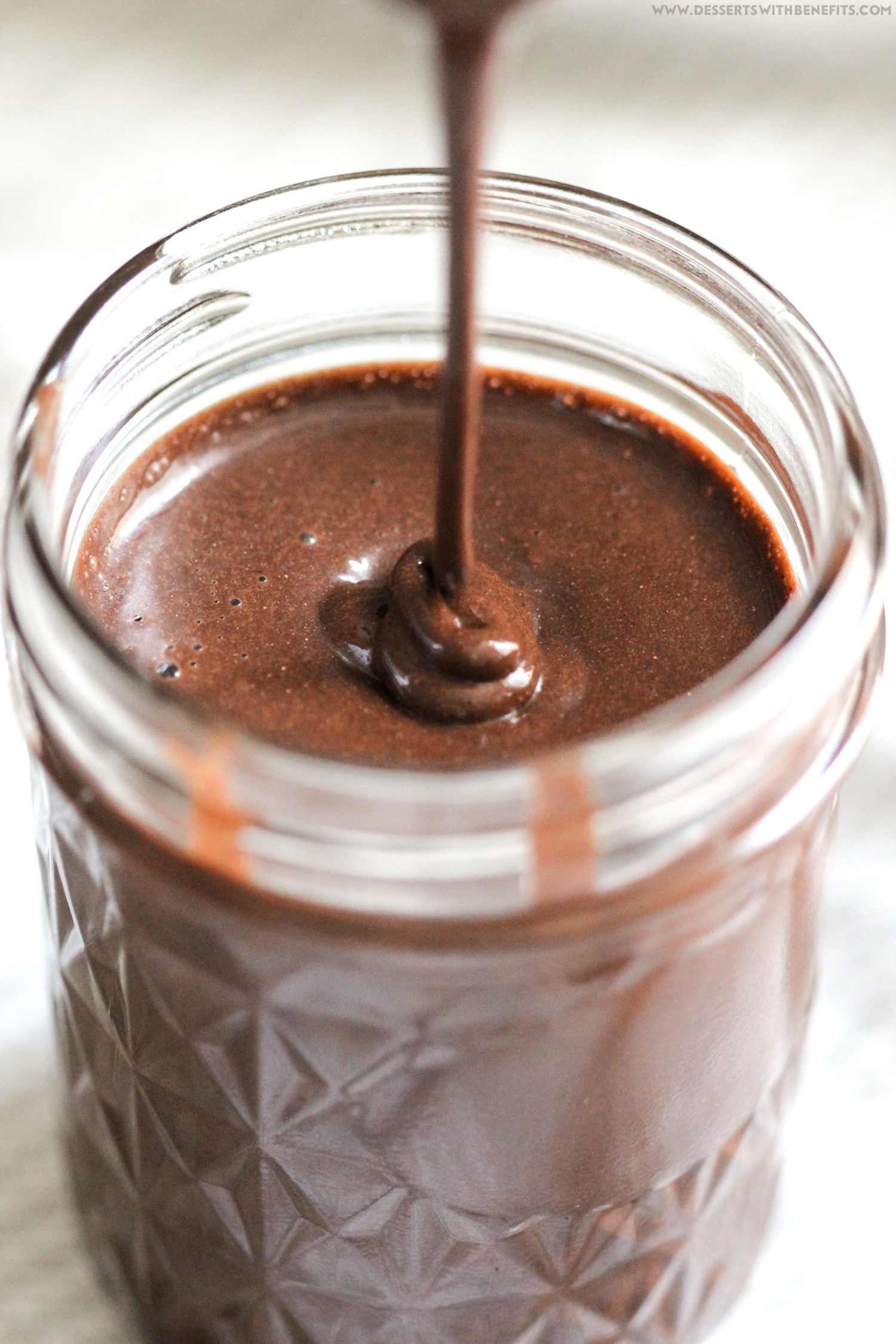 Healthy Homemade Chocolate Syrup recipe -- thick, rich, sweet, and chocolatey, yet secretly sugar free, low fat, high fiber, gluten free, and vegan! Perfect in chocolate milk, milkshakes, smoothies, oatmeal, and more. Healthy Dessert Recipes at Desserts with Benefits