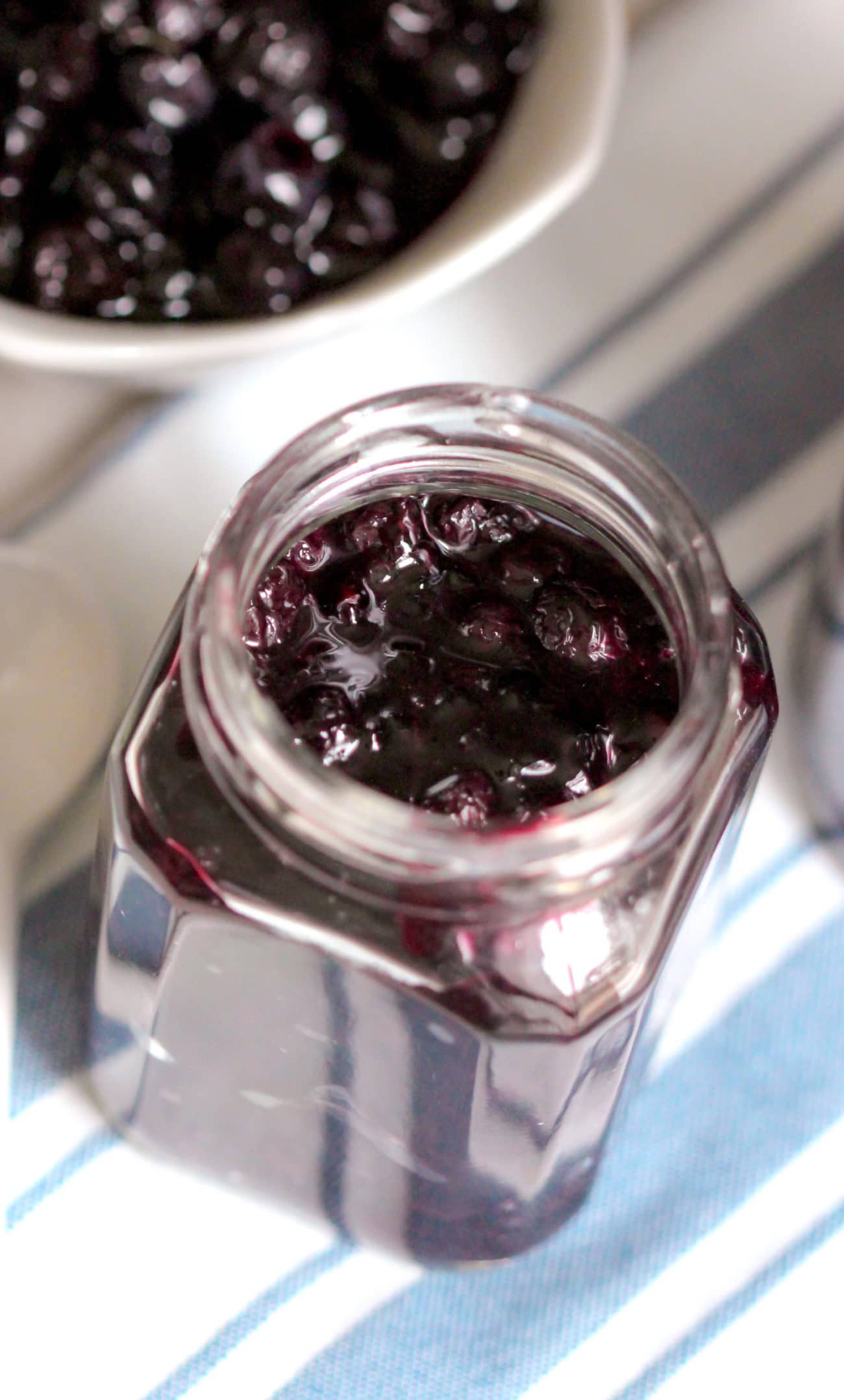 This Healthy Blueberry Compote Topping recipe is sweet and BURSTING with bright and fresh blueberry flavor, yet it's secretly all natural, refined sugar free, fat free, gluten free, dairy free, and vegan! Perfect for topping pancakes, waffles, oatmeal, yogurt, cheesecake, pound cake, and more!