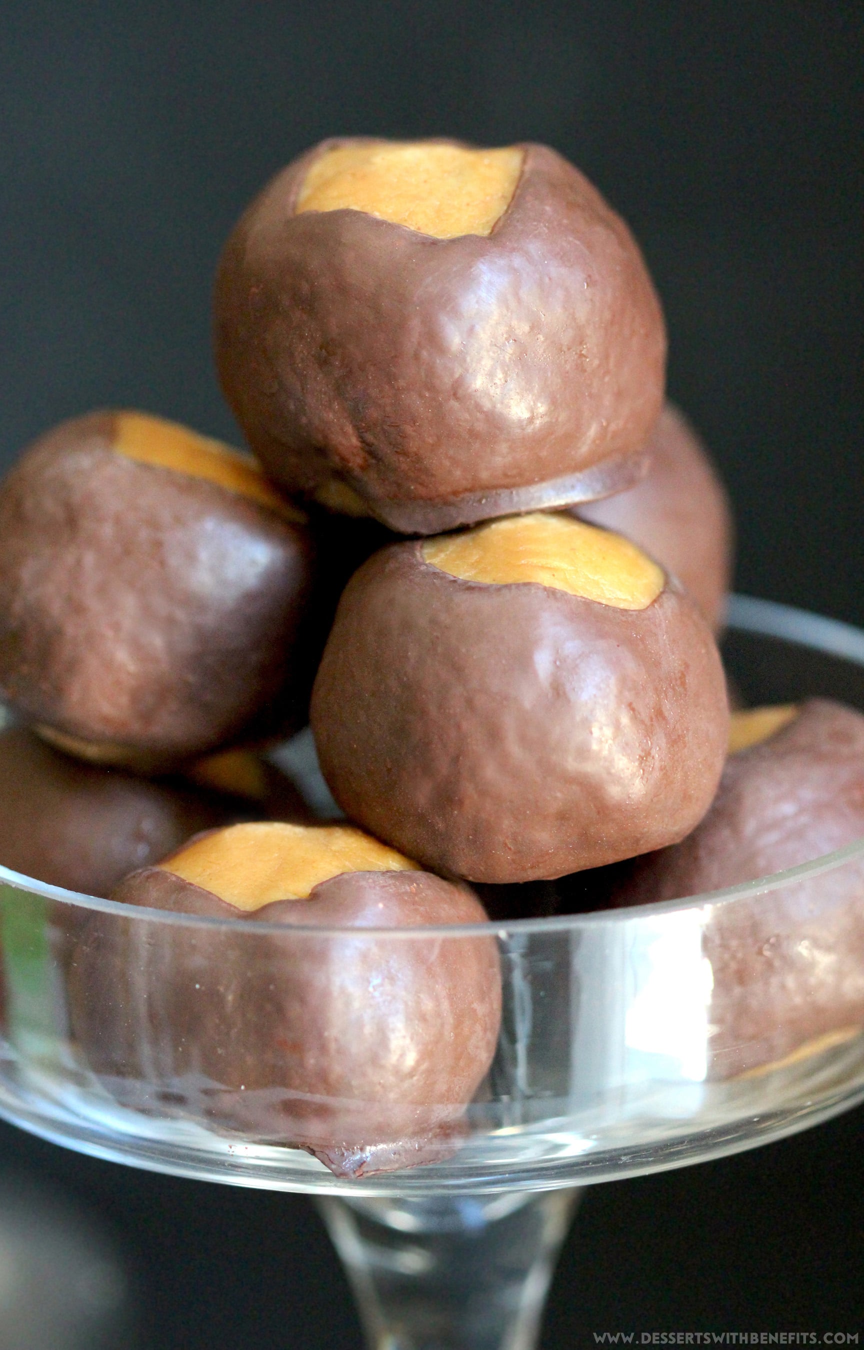 These Healthy Buckeye Balls are sweet and fudgy, peanut buttery orbs of magic surrounded by a layer of rich and decadent dark chocolate. It’s hard to believe they’re refined sugar free, low carb, high protein, and gluten free! Healthy Dessert Recipes at Desserts with Benefits