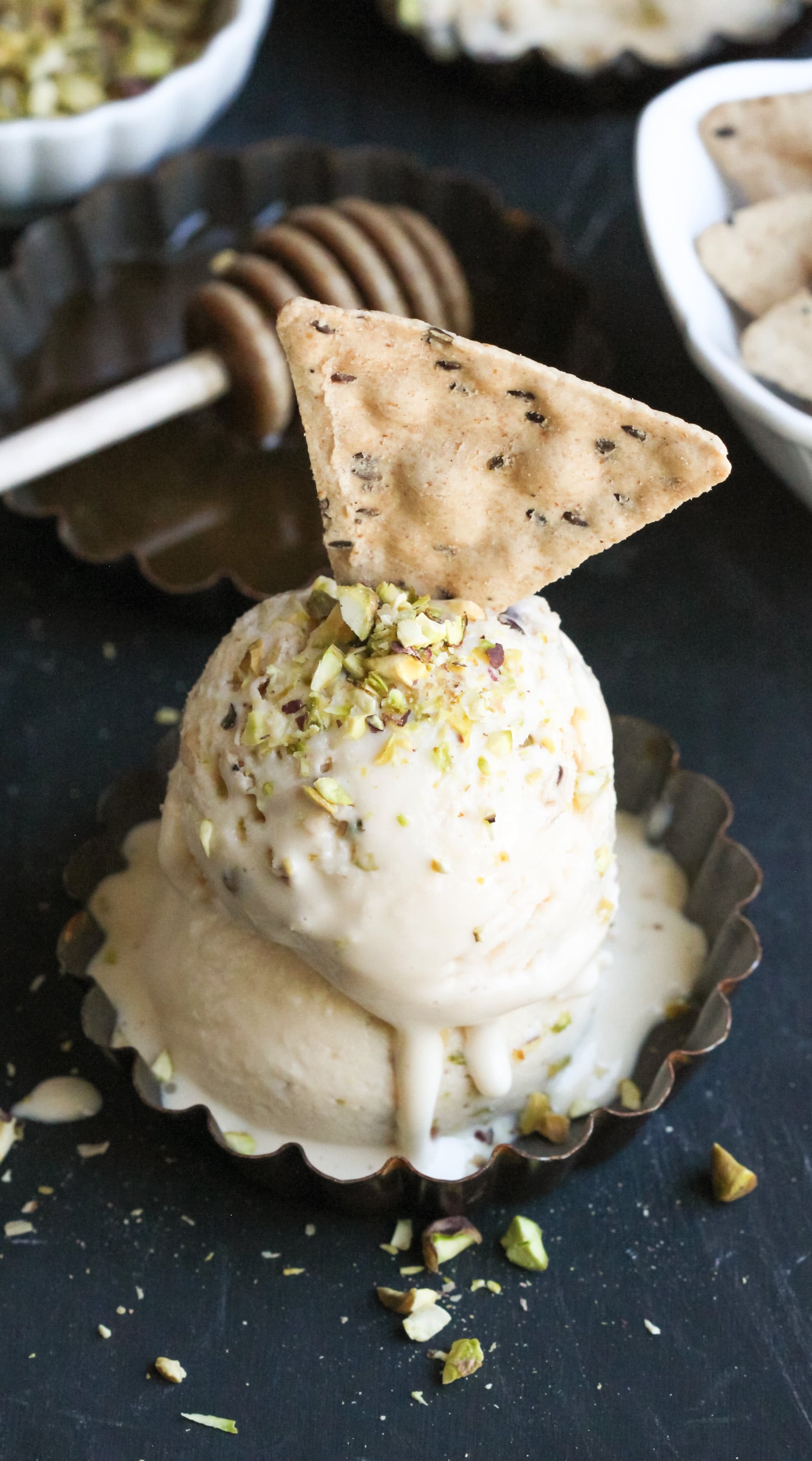 This deliciously sweet and creamy Healthy Baklava Ice Cream is laced with raw honey and studded with chopped pistachios and a crunchier, crispier, and more nutritious gluten-free substitute to phyllo dough. It seriously tastes like baklava swirled into ice cream! You’d never know it’s refined sugar free, gluten free, and high protein! -- Healthy Dessert Recipes with sugar free, low calorie, low fat, high protein, gluten free, dairy free, and vegan options at the Desserts With Benefits Blog (www.DessertsWithBenefits.com)