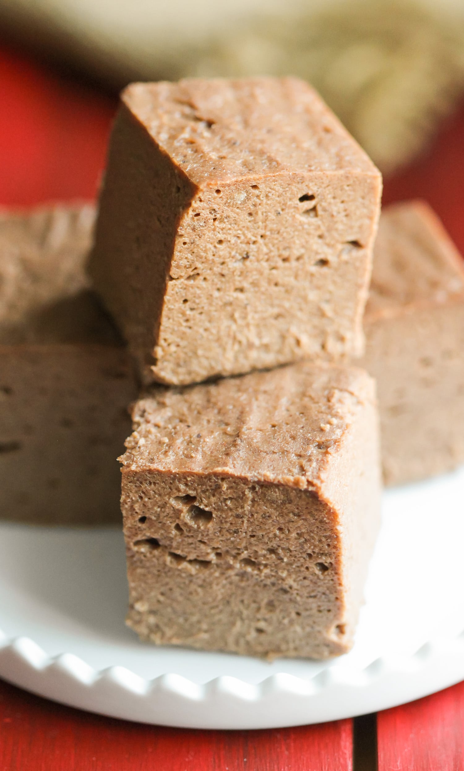 This Healthy Nutella Fudge is sweet, chocolatey, fluffy, and delicious. Oh, and it's made with two secret ingredients! Can you guess what they are? This addicting fudge is packed full of protein, fiber, and healthy fats, and none of the added sugar or artificial ingredients. It sure doesn’t taste low calorie, sugar free, low carb, high protein, high fiber, and gluten free! -- Healthy Dessert Recipes at the Desserts With Benefits Blog (www.DessertsWithBenefits.com)