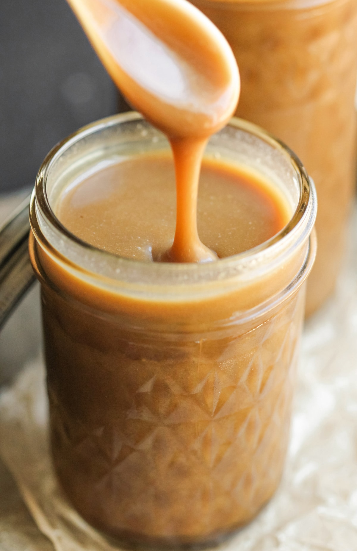 How to make Healthy Homemade Caramel Sauce! This sweet and velvety caramel sauce is made without the white sugar, corn syrup, heavy cream, and butter, but you’d never know it. And did I mention it’s vegan, dairy free, and gluten free too? Don’t buy caramel sauce, DIY it! -- Healthy Dessert Recipes with sugar free, low calorie, low fat, high protein, gluten free, dairy free, and vegan options at the Desserts With Benefits Blog (www.DessertsWithBenefits.com)