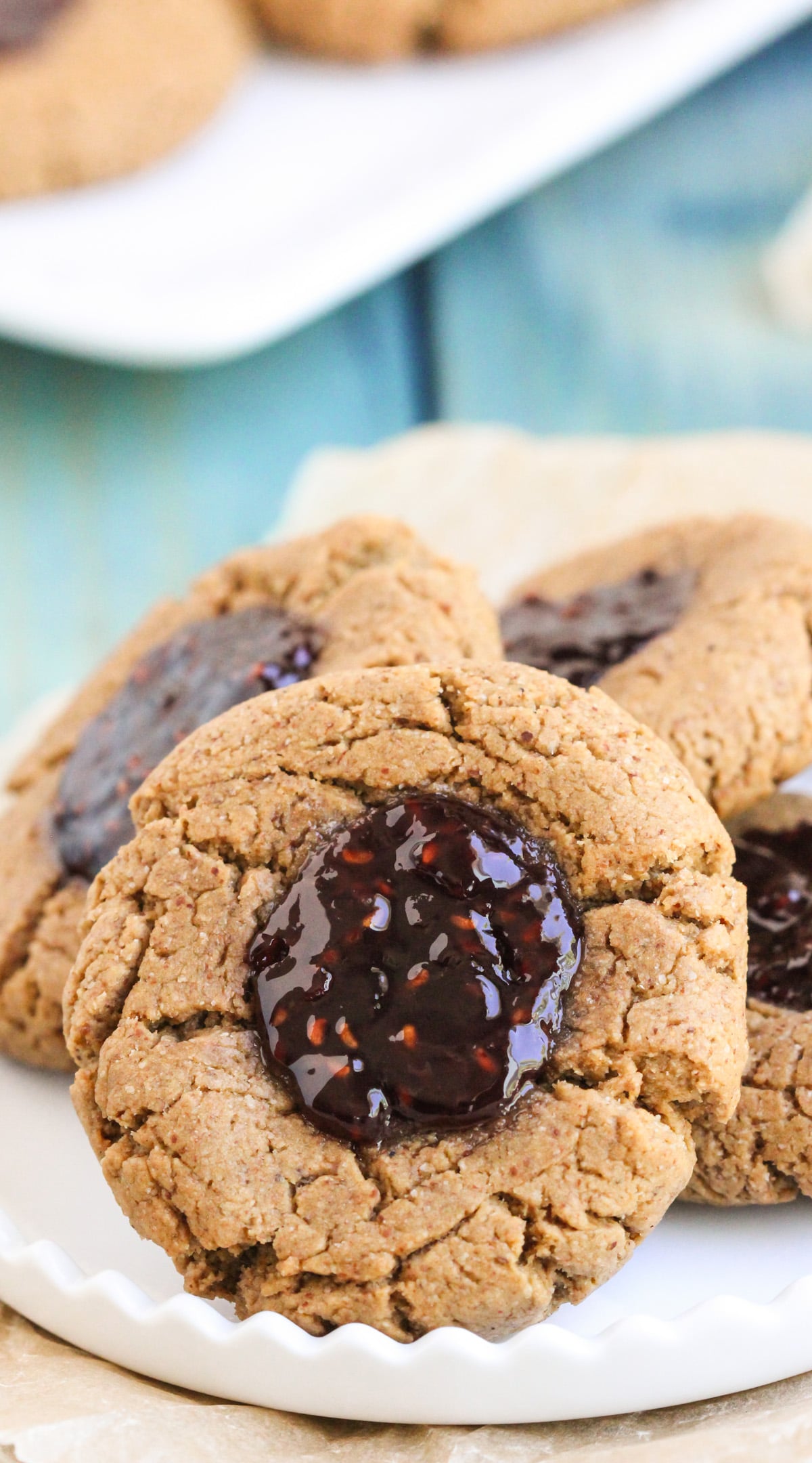 These soft and chewy 7-ingredient Healthy Thumbprint Cookies are so simple and delicious, you'd never know they're refined sugar free, gluten free, dairy free, and vegan! Healthy Dessert Recipes with low calorie, low fat, high protein, high fiber, and raw options at the Desserts With Benefits Blog (www.DessertsWithBenefits.com)