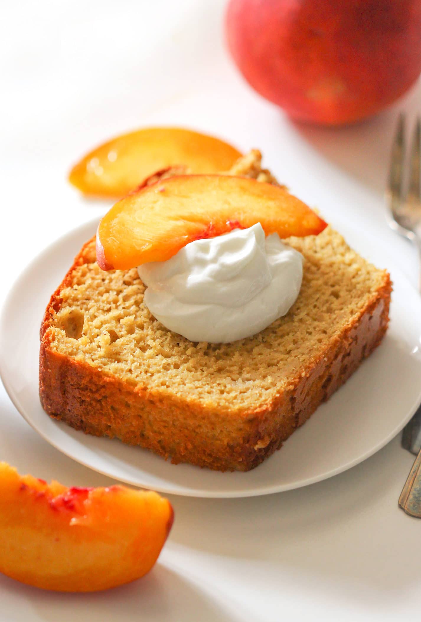 Healthy Nectarine Olive Oil Pound Cake! Yes, olive oil in a dessert, and it works! This light cake is perfectly sweet and 100% satisfying. Made with whole wheat flour, yogurt, and organic extra virgin olive oil, and none of the butter or sugar… but you’d never know it! Healthy Dessert Recipes with sugar free, low calorie, low fat, low carb, high protein, gluten free, dairy free, vegan, and raw options at the Desserts With Benefits Blog (www.DessertsWithBenefits.com)