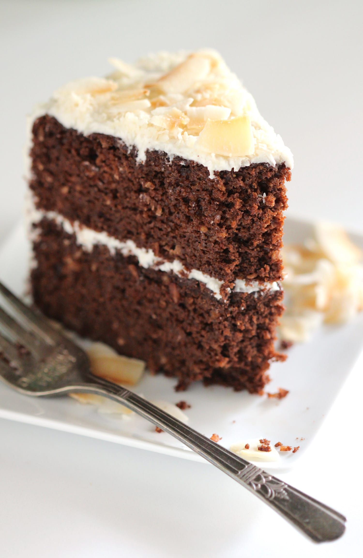 This Healthy Chocolate Coconut Cake is super fluffy, supremely chocolatey, and speckled with shredded coconut throughout. It seriously doesn't taste like it's low in sugar, high in protein, or gluten free whatsoever! Healthy Dessert Recipes with sugar free, low calorie, low fat, low carb, high protein, gluten free, dairy free, vegan, and raw options at the Desserts With Benefits Blog (www.DessertsWithBenefits.com)