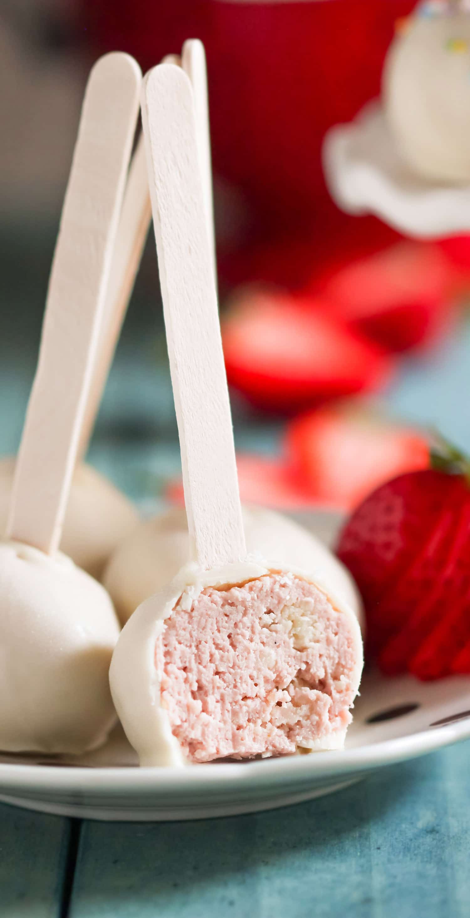 These Gluten Free Strawberry Shortcake Cheesecake Truffles are made with real strawberry cheesecake and sugar cookies chunks, and are coated in rich and delicious white chocolate.  If you're looking for a guilt-free bite-sized treat, you've found it! Healthy Dessert Recipes at the Desserts With Benefits Blog