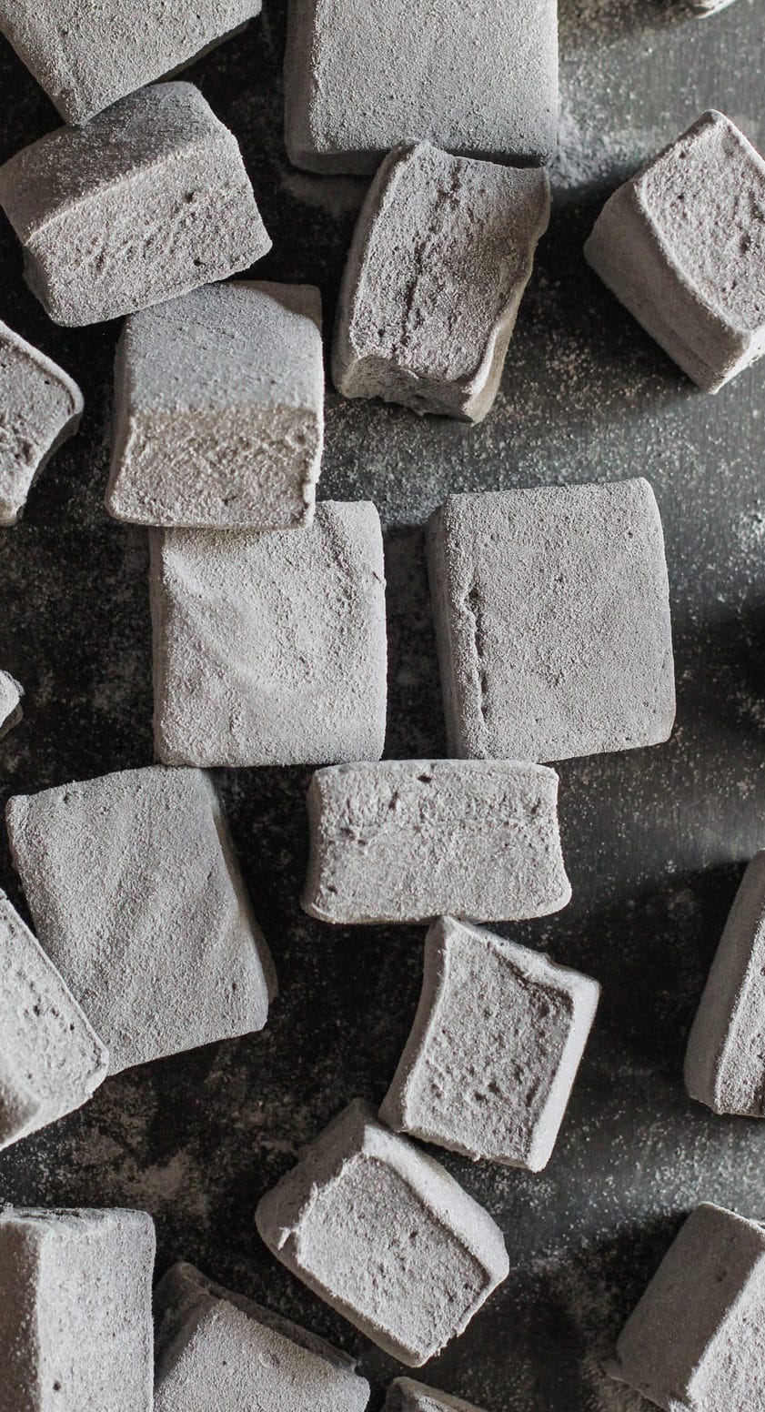 These Healthy Black Velvet Marshmallows are just as sweet and fluffy as regular marshmallows, but they're infused with chocolate and a SECRET INGREDIENT! These homemade marshmallows are naturally sweetened and naturally colored – made without corn syrup and artificial food dye. PERFECT for Halloween! (How to Make Marshmallows) Healthy Dessert Recipes at the Desserts With Benefits Blog