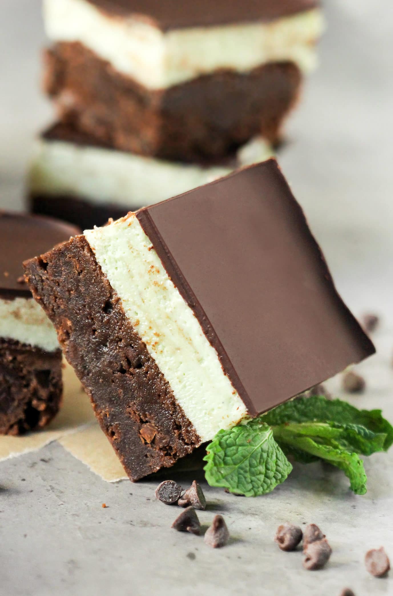 These Grasshopper Brownies are chocolatey, minty, sweet, and SUPREMELY delicious! Made with the fudgiest of the fudgy brownie base, a thick layer of mint frosting, and the perfect amount of dark chocolate to top everything off. This is one incredible, if not mind-blowing, dessert! Healthy Dessert Recipes at the Desserts With Benefits Blog (www.DessertsWithBenefits.com)