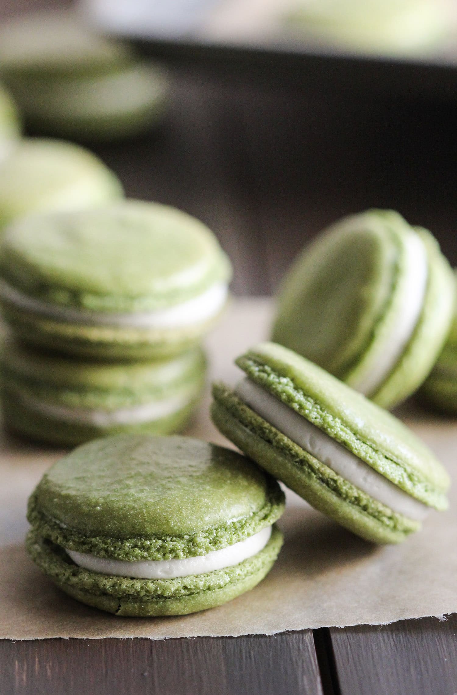 These Healthy Matcha Green Tea French Macarons aren't your typical macarons... these are made without the bleached white sugar, artificial flavorings, and artificial food dyes! That vibrant green you see is ALL NATURAL. These bite-sized treats are sweet, addicting, unique, and sophisticated. They're all natural, low fat, and gluten free too! Healthy Dessert Recipes at the Desserts With Benefits Blog