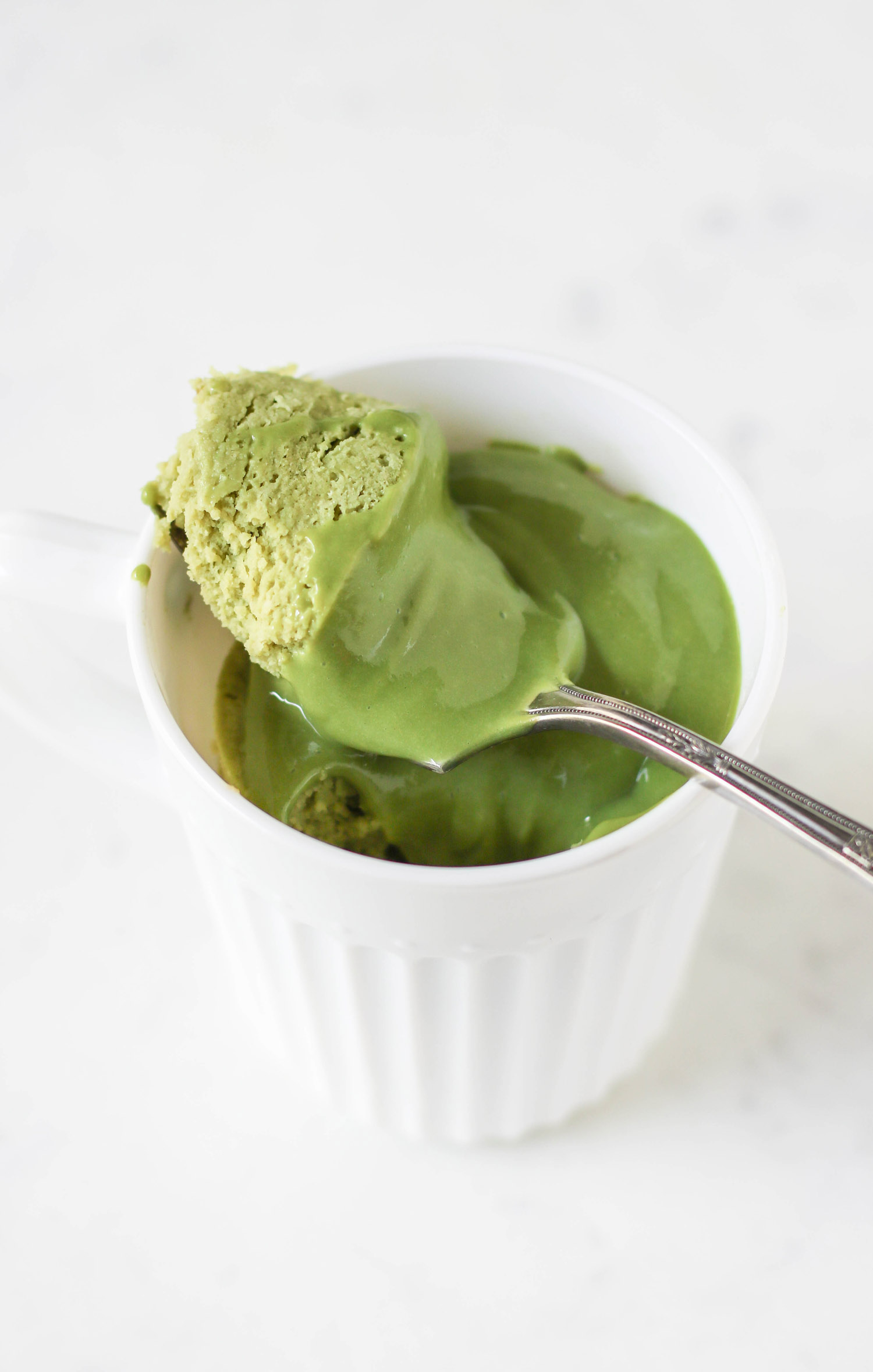 You can make this Healthy Single-Serving Matcha Microwave Cake in TWO minutes flat! This soft, springy, delicious cake makes the perfect balanced breakfast, snack, AND dessert. Plus, a Matcha Protein Frosting to top it off. This entire recipe has just 180 calories, and is sugar free, low carb, high protein, high fiber, and gluten free too! Healthy dessert recipes at the Desserts With Benefits Blog (www.DessertsWithBenefits.com)