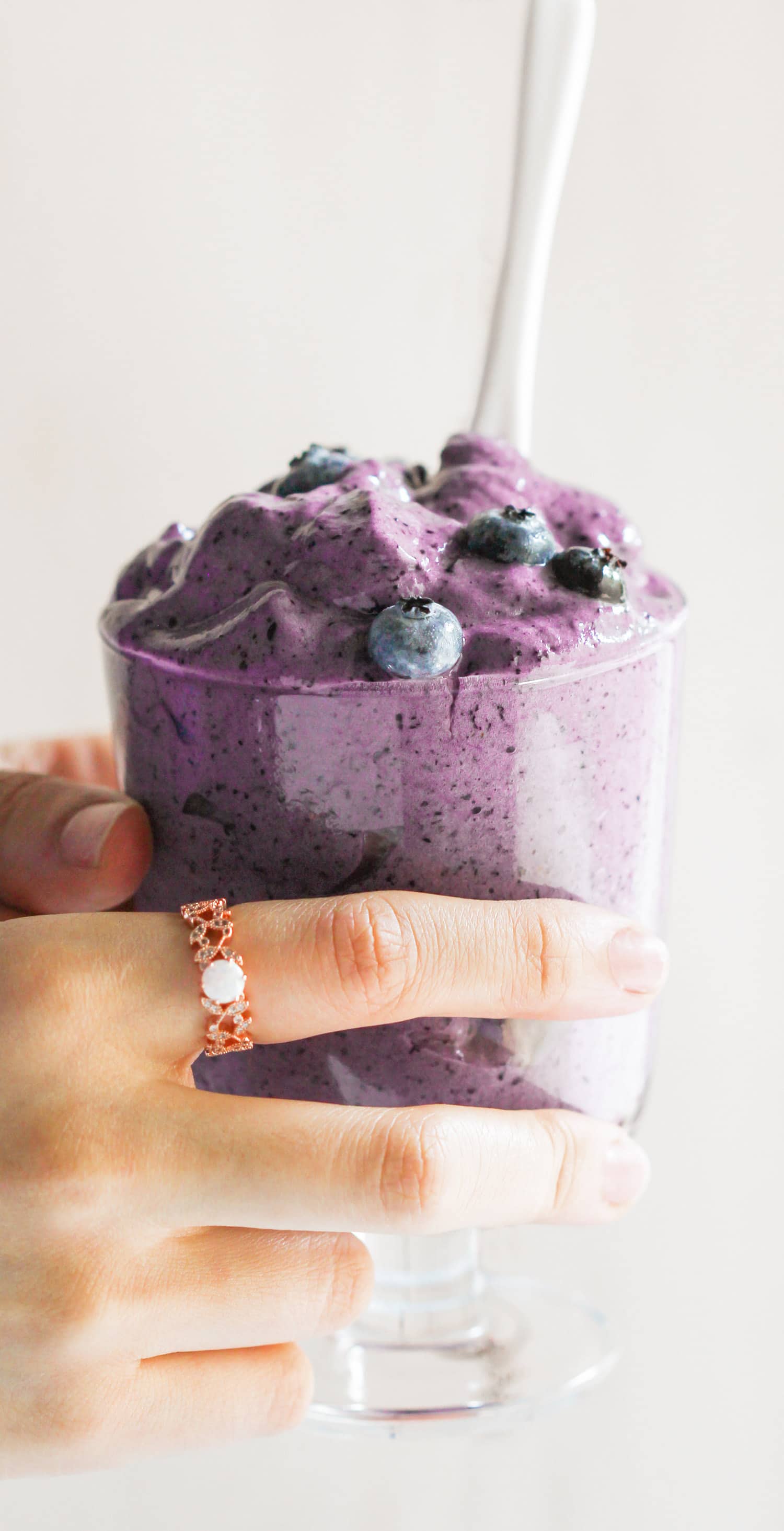 This Healthy Blueberry Protein Fluff is like a mixture between ice cream, whipped cream, and a cloud. So fluffy and voluminous with only 80 calories per serving. Plus, it's refined sugar free, low fat, high protein, and eggless! Healthy Dessert Recipes with sugar free, low calorie, low fat, low carb, high protein, gluten free, dairy free, vegan, and raw options at the Desserts With Benefits Blog (www.DessertsWithBenefits.com)