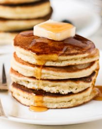 These fluffy Low Carb Coconut Flour Pancakes are THE best way to start your day. One bite and you'll wonder how these Paleo Pancakes are sugar free, low carb, high protein, high fiber, gluten free, and dairy free! These filling Low Carb Pancakes have just 220 calories plus 15g of protein and no sugar added. This is a breakfast we can feel good about indulging in.