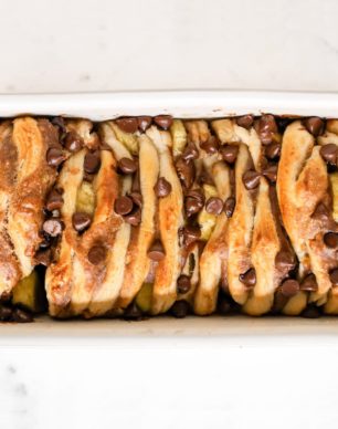 Chunky Monkey Pull Apart Bread -- a sweet loaf made of layers of dough, filled with bananas, rich peanut butter, and decadent chocolate chips. This 5-ingredient recipe is dairy free, vegan, and doesn't have any added sugar... but you'd never know it!