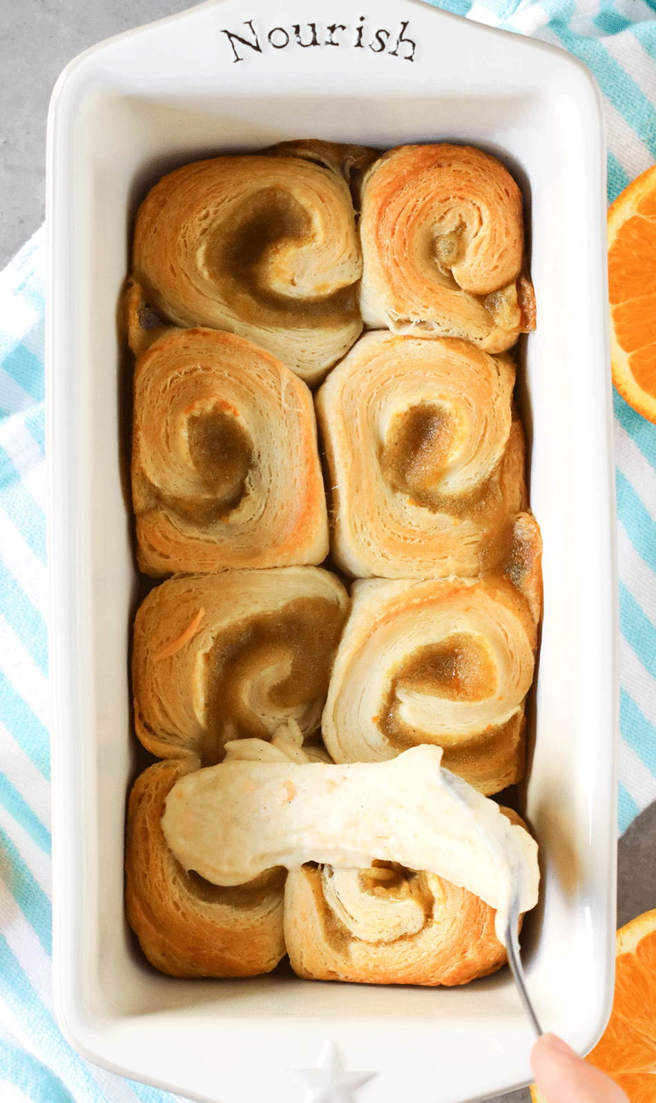 5 ingredient Orange Sweet Rolls in a ceramic loaf pan