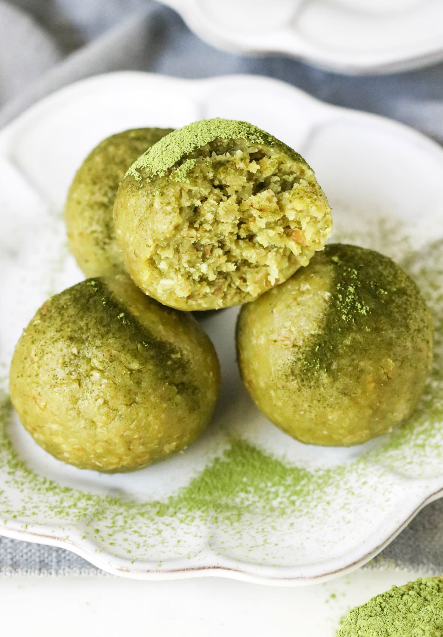 These Matcha Green Tea Energy Bites are soft, fudgy, sweet -- they're a real guilt-free treat. Made with nut butter, oats, and matcha powder. You'd never know they're sugar free, gluten free, dairy free, vegan, and keto-friendly too!