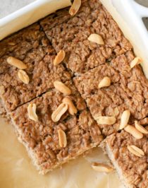 This healthy Peanut Butter Baked Oatmeal is soft and light, yet packed with protein, fiber, and healthy fats, and none of the added sugar! Plus, it's sugar free, gluten free, dairy free, and vegan too!