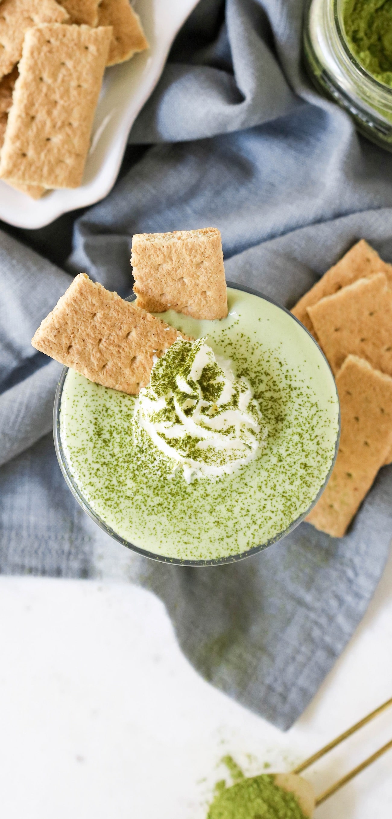 This 100-calorie Matcha Green Tea Cheesecake Dip is ultra smooth, creamy, sweet, and satisfying. It tastes just like matcha cheesecake batter, except this version is sugar free, low carb, low fat, and high protein!  Only five ingredients and a few minutes needed to whip this together -- you'll be guilt-free snacking in no time!