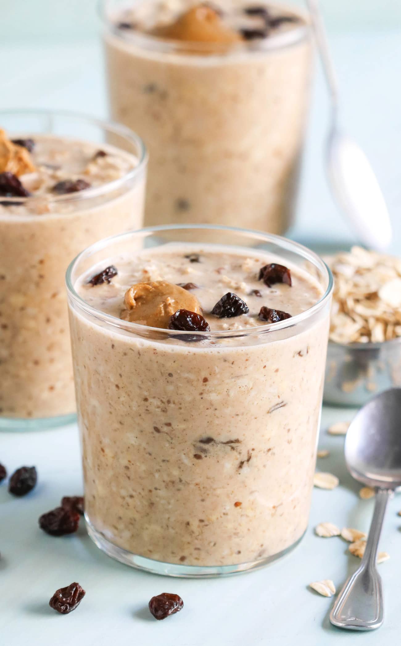 These Oatmeal Raisin Cookie Overnight Dessert Oats have all the flavor of oatmeal raisin cookies but in oatmeal form, and without the butter, oil, and sugar! Gluten free and vegan, and made with whole grain oats, nut butter, and a hint of vanilla and cinnamon.