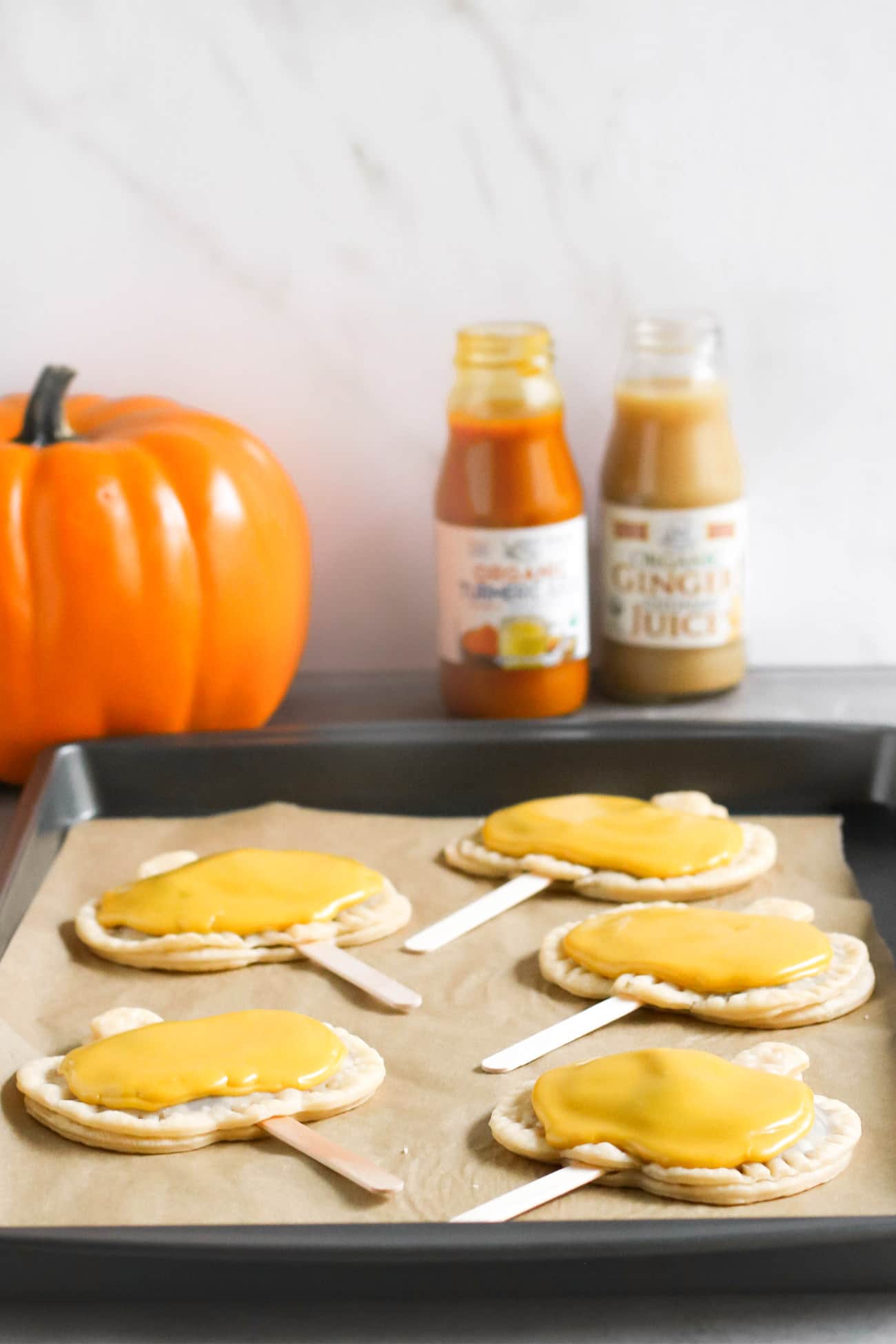 Pumpkin Pie Pops -- where Pumpkin Pie meets limited edition Pumpkin Pie Pop Tarts meets secretly good-for-you deliciousness! They’re rich and sweet to satisfy your sweet tooth, and they’re secretly vegan, dairy free, and low sugar too! What can be better than homemade pumpkin pie filling all wrapped up in a flavorful pie crust? Everything about these screams Fall, Halloween, cool weather, fuzzy sweaters, and good feels. These are a guaranteed crowdpleaser, and definitely a dessert to impress!