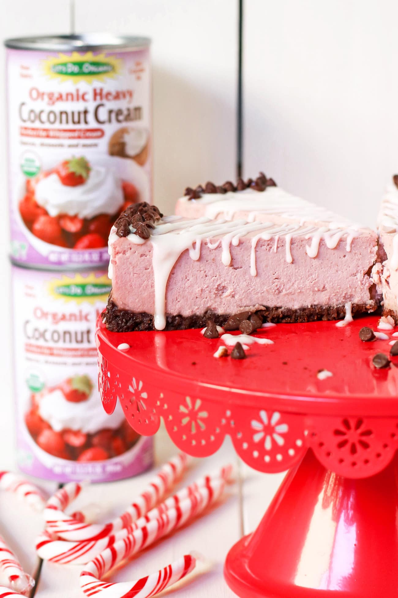 This deliciously rich and creamy no-bake Raw Vegan Peppermint Cheesecake is creamy without the cream cheese, fluffy without the eggs, and secretly sugar free and gluten free too!  No baking required, no water bath needed. Perfect for the holidays, birthdays, parties, or no reason at all!