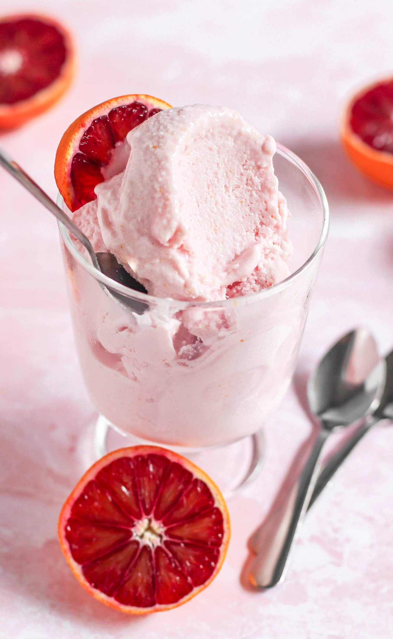 This 5-ingredient Blood Orange Ice Cream is sweet, tart, citrusy, and oh so satisfying. No need for the heavy cream, white sugar, artificial flavors, and artificial food dyes! This is the perfect ice cream to indulge in, guilt-free! Compared to store-bought ice cream, this is lower in calories, fat, and sugar, and higher in protein!