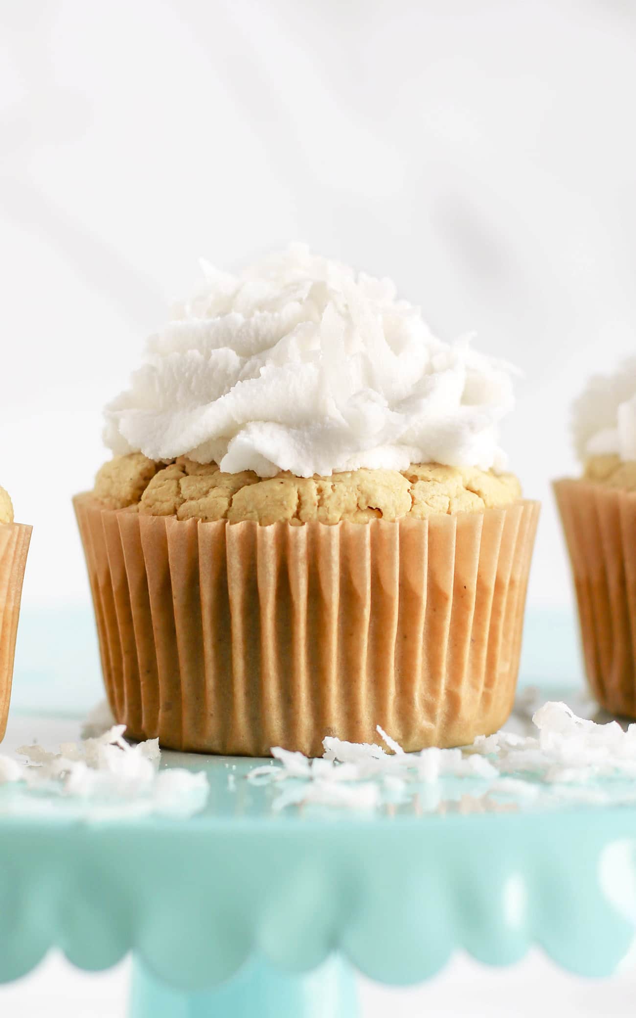 These Healthy Coconut Cupcakes are fluffy, springy, and moist! They're the most nutritious, guilt-free treat! Made with quinoa flour, sorghum flour, coconut yogurt, and coconut milk, so they're gluten free, dairy free, vegan, and sugar free!