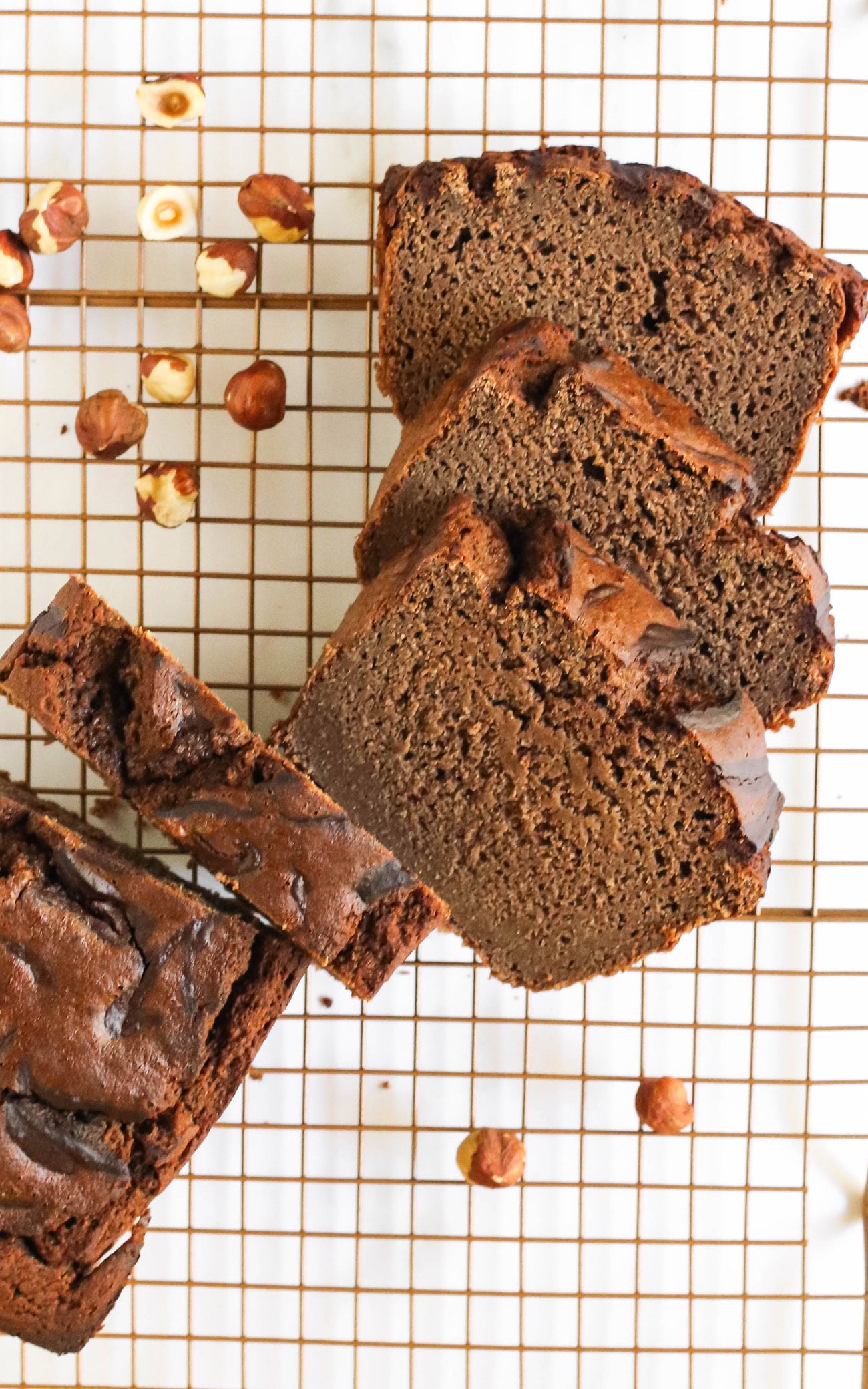 This Nutella Banana Bread is so moist, fluffy, springy, and chocolatey! It doesn't taste healthy, sugar free, gluten free, dairy free, high protein, or whole grain ONE BIT. It tastes like it's from a bakery! Made with low carb, paleo, and keto-friendly homemade Nutella!