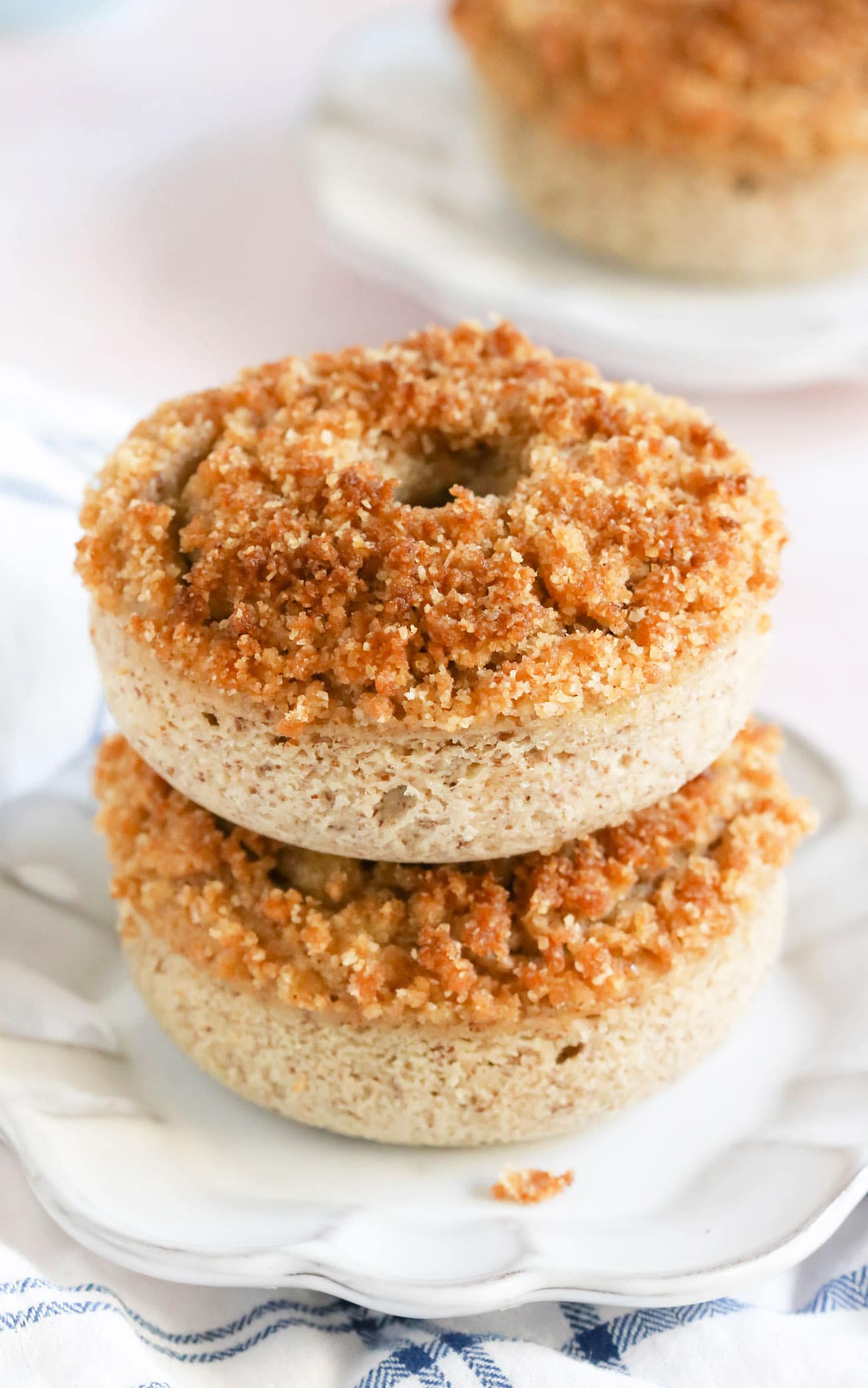 These easy Baked Crumb Donuts are rich, sweet, full of vanilla flavor, and a coffee cake-like crumb topping. Every bite is buttery and satisfying. You'd never know these donuts are gluten free, high protein, high fiber, and low sugar!